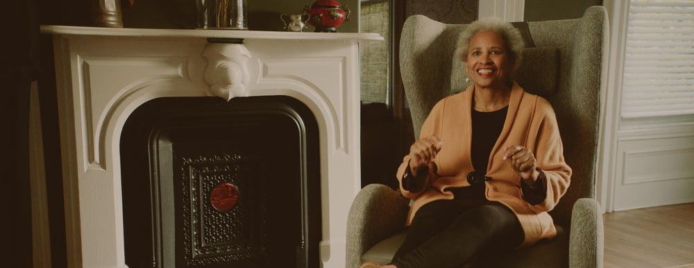 Smiling woman sitting in comfortable chair
