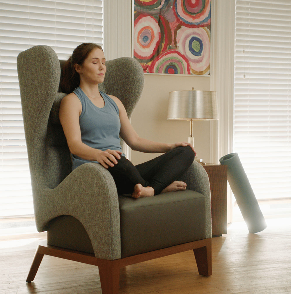 Woman meditating in chair