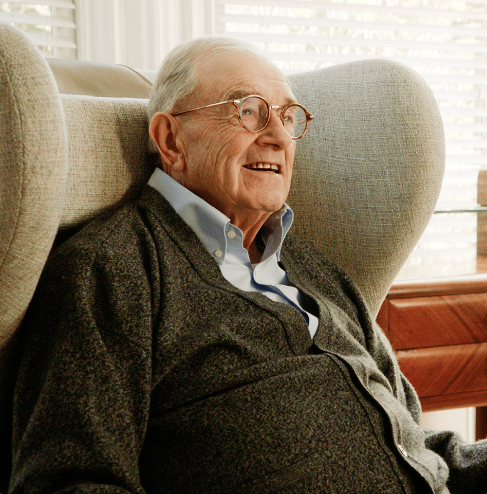 Elderly man sitting in chair